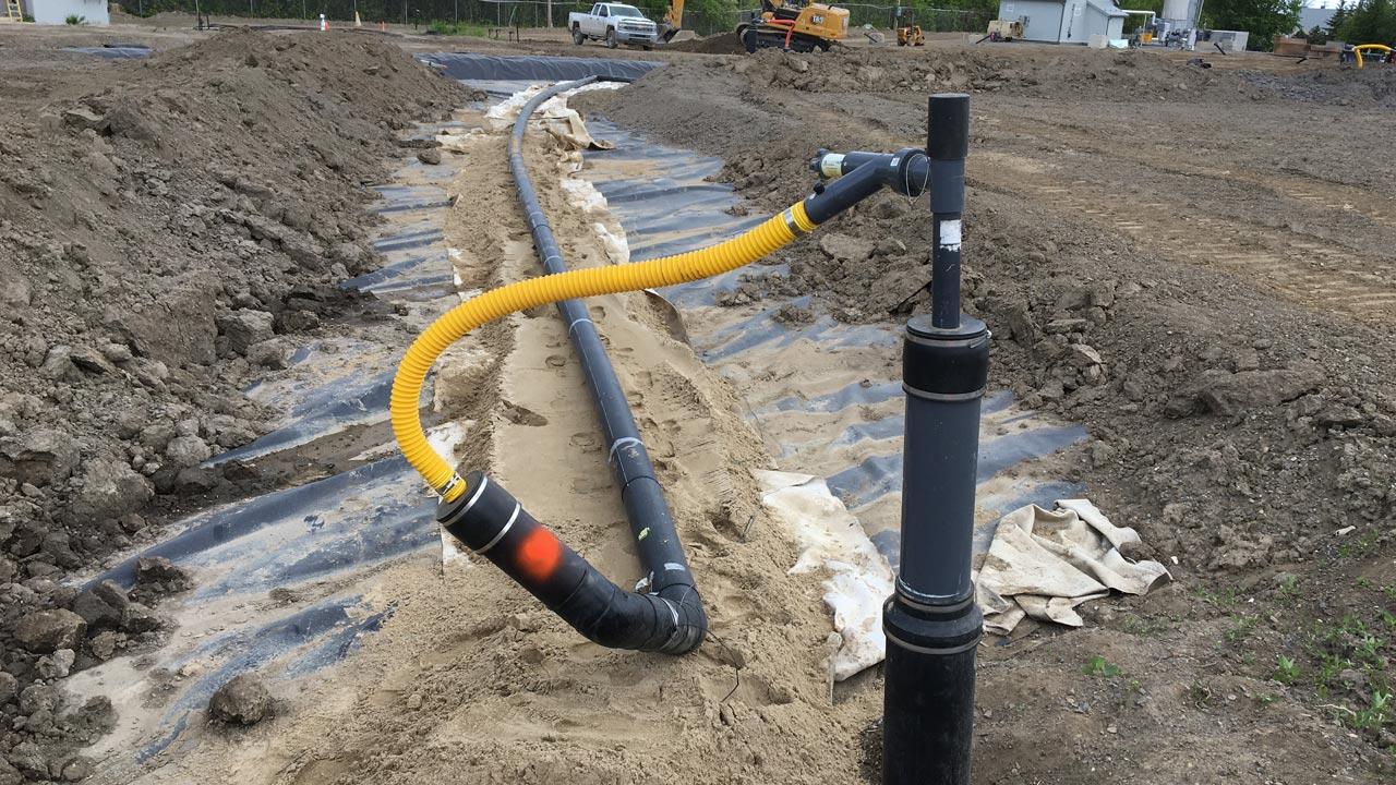 Landfill gas well head and conveyance piping