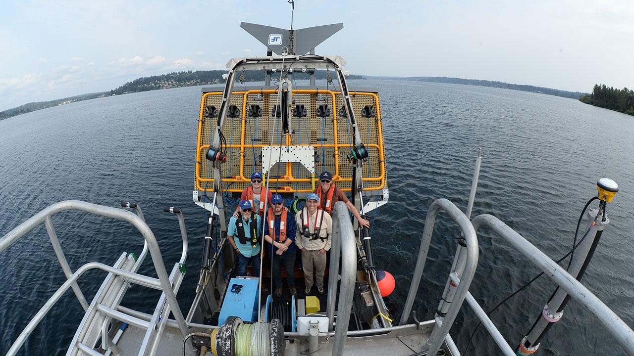 Five Tetra Tech bathymetric survey crew members pose with Ultra TEMA-4 for detection of underwater munitions and unexploded ordnance